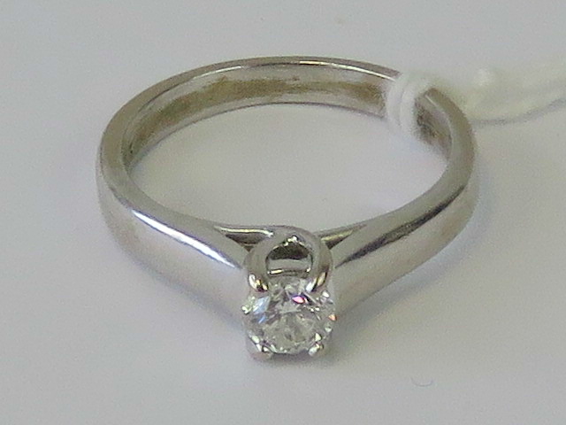 An 18ct white gold and diamond solitaire ring,