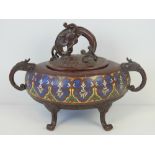 A 19th century heavy cloisonné lidded bowl raised over three feet (one foot deficient) having