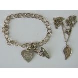 A silver 'Me To You' charm bracelet having heart tag with teddy bear engraved upon, hallmarked 925,