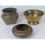 A Chinese brass censor of swollen tapered design incorporating three feet,