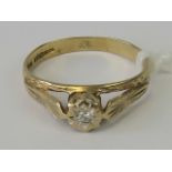 A 9ct gold and diamond ring, illusion set brilliant cut diamond in raised gallery, hallmarked 375,