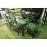 A contemporary metal framed dining table having glass top, 163 x 102cm,