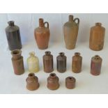 A collection of Victorian and later stoneware ink bottles and others,