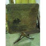 A square shaped four panel tilt top table raised over three outswept feet, 92cm wide,