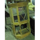 A wall hanging pine lazed display cabinet with single door and open shelf under, 70cm wide.