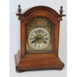 A late 19th century mahogany cased table clock having silvered chapter ring,