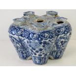 An Oriental influence tulip vase in blue and white having floral scene upon,