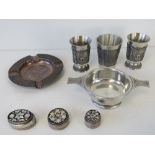 A HM silver ashtray together with three white metal trinket boxes, a quaiche and three tot cups.