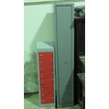 A full size lockable gun cabinet standing 158cm high, 26.5cm wide, complete with key.