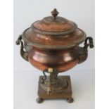 An impressive 19th century copper samovar, complete with lid, side handles and tap, 42cm high.