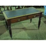 An Edwardian mahogany escritoire writing desk having twin frieze drawers and raised over reeded