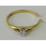 An 18ct gold and platinum solitaire diamond ring, round brilliant cut diamond (approx 2.