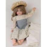 A vintage Simon and Halbig bisque headed sleepy eye doll, marked to the neck 117/A, composite body,