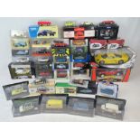 A quantity of assorted model vehicles including; 1:18 scale Mini Cooper by Burago,