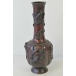 A good bronzed brass gourd type Oriental vase in two sections,