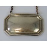 A HM silver decanter label of octagonal form, blank,