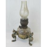 A late Victorian oil lamp with slice cut glass reservoir and Duplex burner,