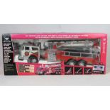A large remote control 'ladder rescue' fire engine No 230 complete within box,