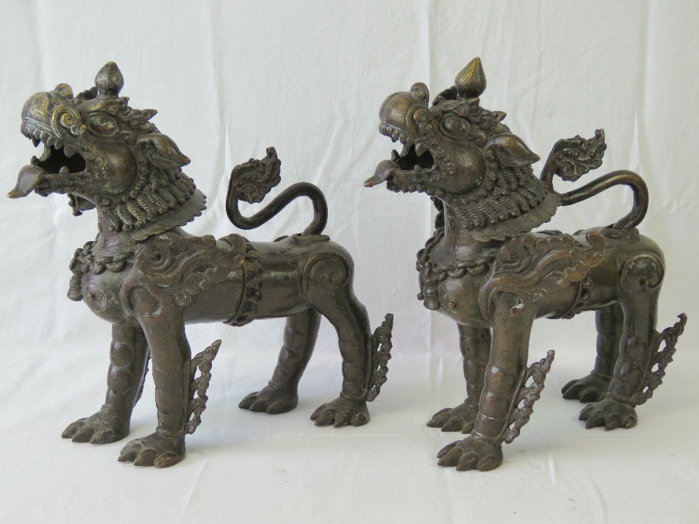 A fine pair of bronze fo temple dogs each ornately cast and standing 31cm high x 30cm in length. - Image 5 of 5