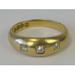 An 18ct gold and diamond gypsy ring,
