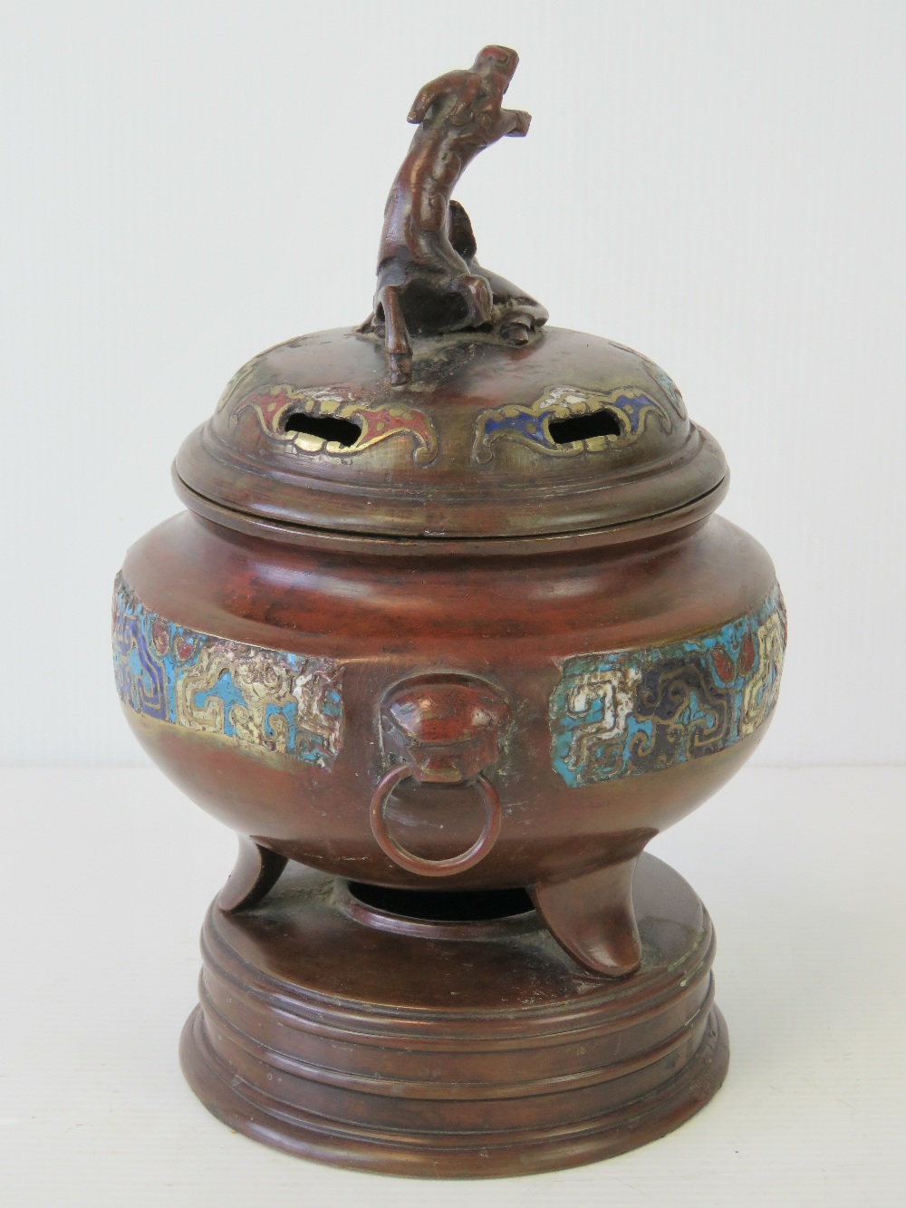 A fine bronze Oriental lidded censer having a band of cloisonné decoration and raised over three - Image 2 of 4