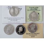 A quantity of presentation silver proof coins including Queen Elizabeth II £5 coin,