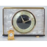 A vintage Art Deco style Metamec brass and faux mother of pearl mantle clock,