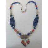 A Native American style handmade necklace having lapis lazuli, coral and turquoise beading,