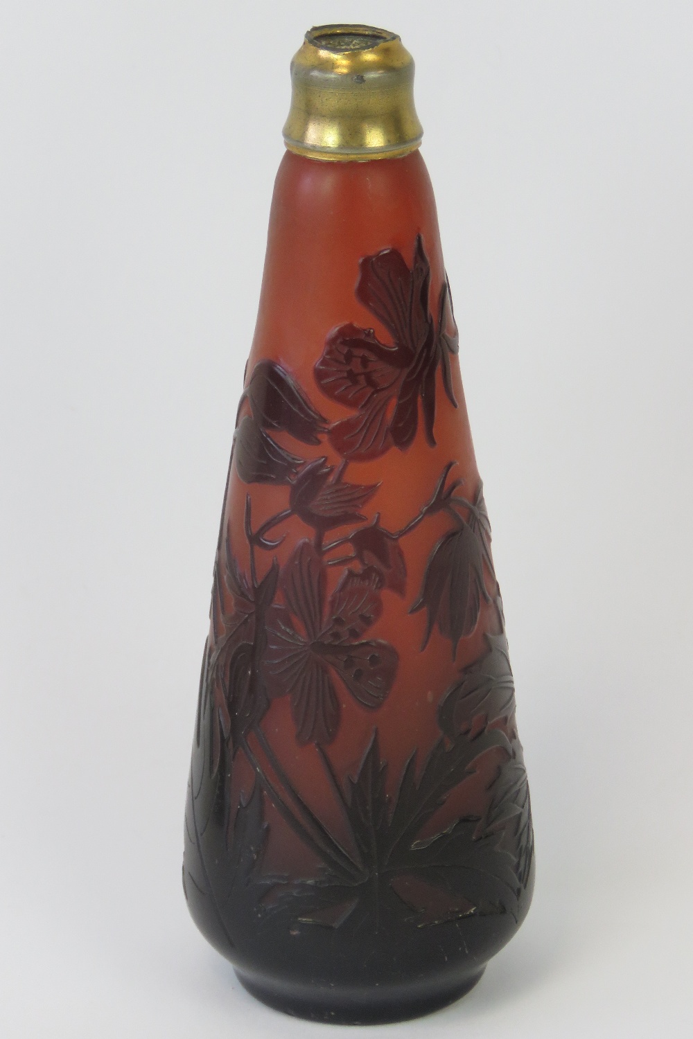 An Emile Gallé (1846-1904 ) Cameo Glass perfume bottle with magenta and cherry red floral pattern