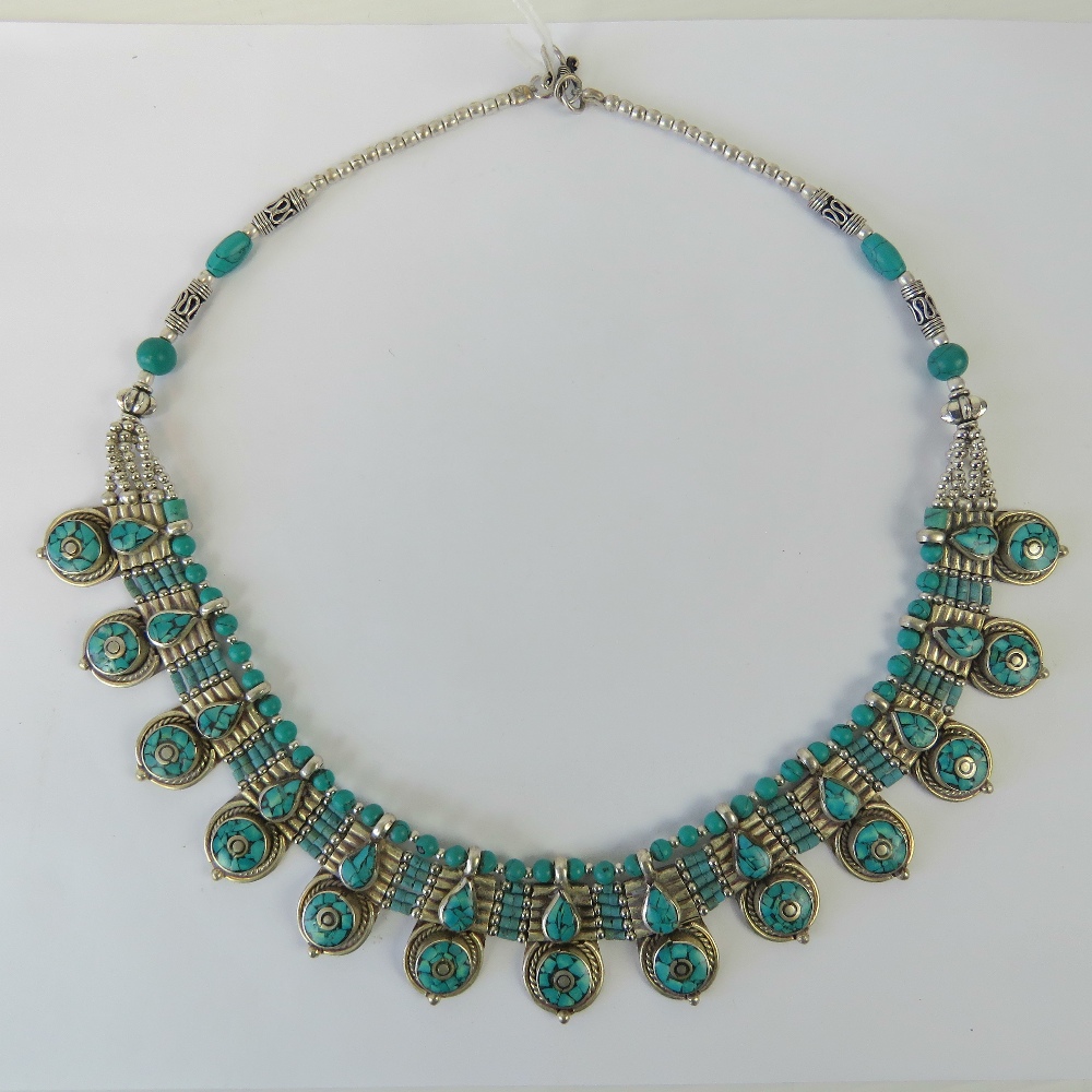 A Native American style turquoise and white metal beaded necklace, approx 50cm in length.