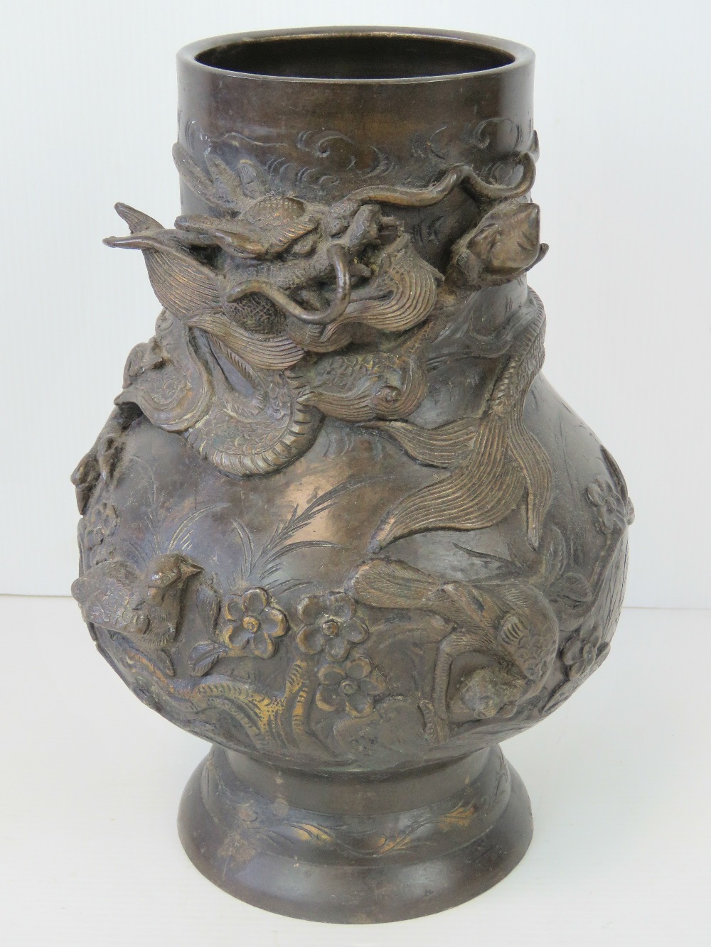 A 19th century bronzed brass Oriental vase profusely decorated in relief with dragons upon, - Image 2 of 4