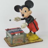 A vintage wind-up clockwork Mickey Mouse playing xylophone by Walt Disney Productions c1950s,