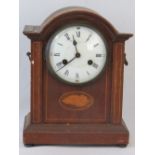 An Edwardian mahogany eight day striking table clock, enamelled dial with Roman numerals,