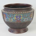 A large bowl having three decorative cloisonné panels upon all within the cellular geometric