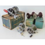 A Penn Squidder 140 multiplier reel with two spare spools and boxes,