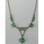 A delightful Art Deco necklace having three geometric stepped panels separated by two square cut