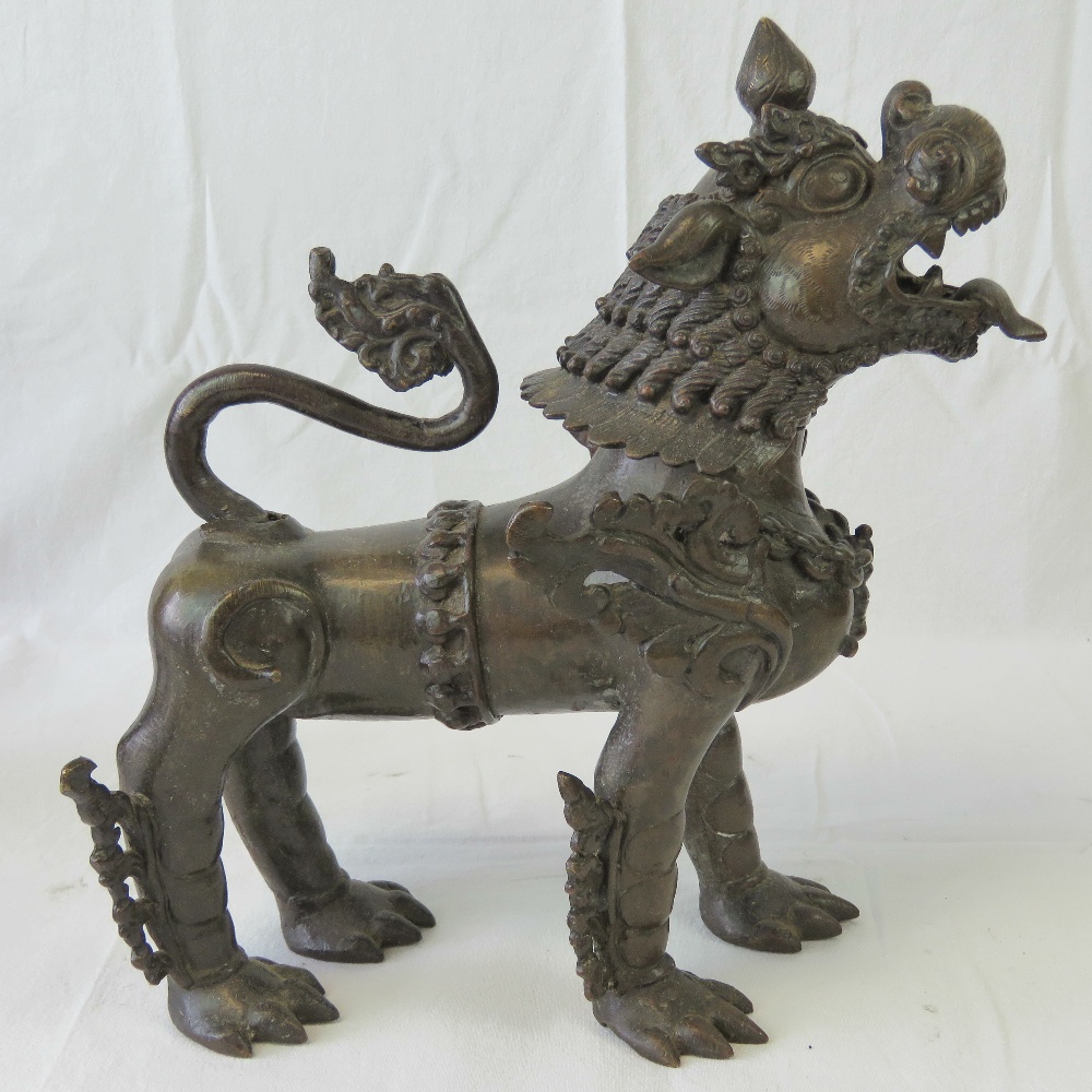 A fine pair of bronze fo temple dogs each ornately cast and standing 31cm high x 30cm in length. - Image 2 of 5