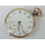 An Omega gunmetal and gold plated open face pocket watch, top wind,