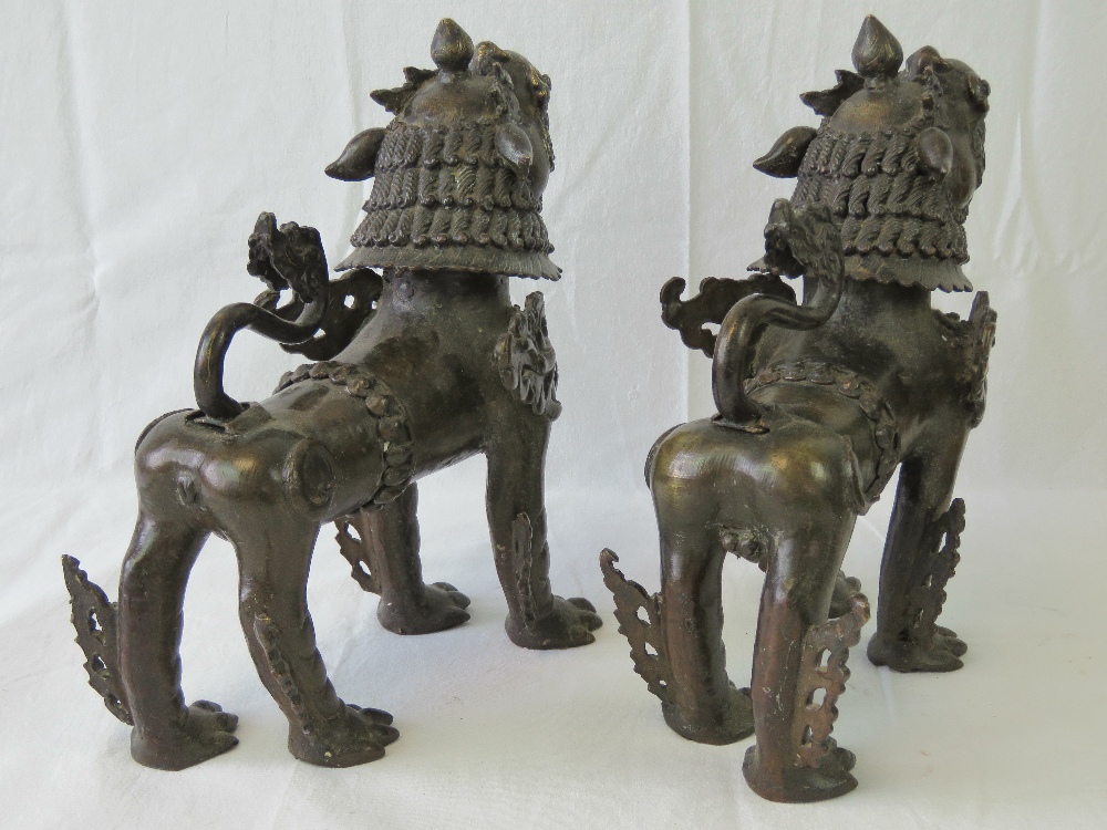 A fine pair of bronze fo temple dogs each ornately cast and standing 31cm high x 30cm in length. - Image 3 of 5