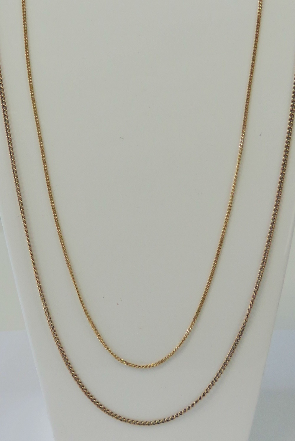 Two 9ct gold fine link chains, 64cm and 46cm respective lengths, 8.