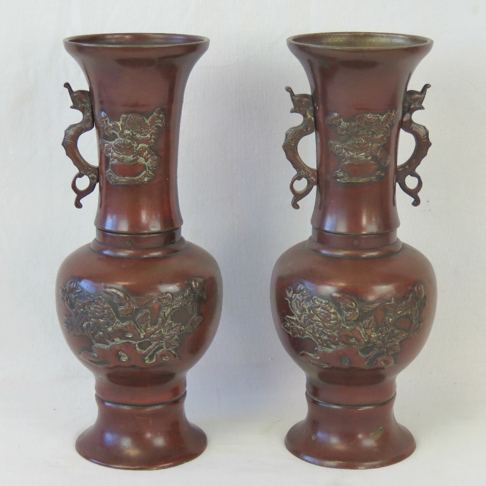 A pair of 19th century Oriental export bronzed brass relief vases, one handle deficient. - Image 2 of 2