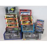 A collection of five Burago model F1 racing cars with boxes,