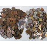 A quantity of assorted coinage including; a silver South Africa sixpence,