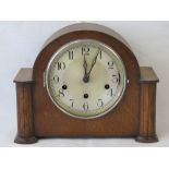 An oak cased mantle clock, movement marked Haller, glass deficient, 28.5cm wide.