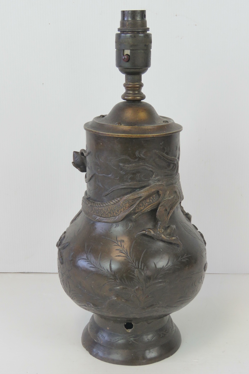A 19th century bronzed brass Oriental vase profusely decorated in relief with dragons upon, - Image 4 of 4