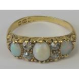 An 18ct gold opal and diamond ring,