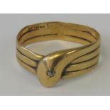 A yellow gold serpent ring having rubbed Chester hallmark (18ct?),