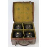 A vintage fitted leather bowls case cont