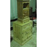 A pine cupboard having twin doors with s