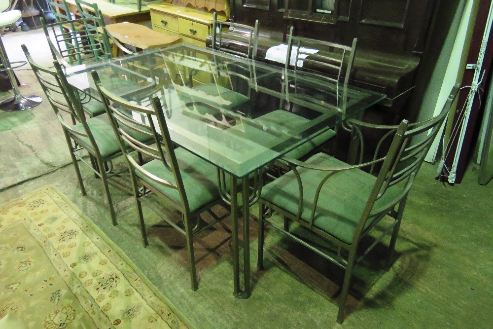 A contemporary metal framed dining table